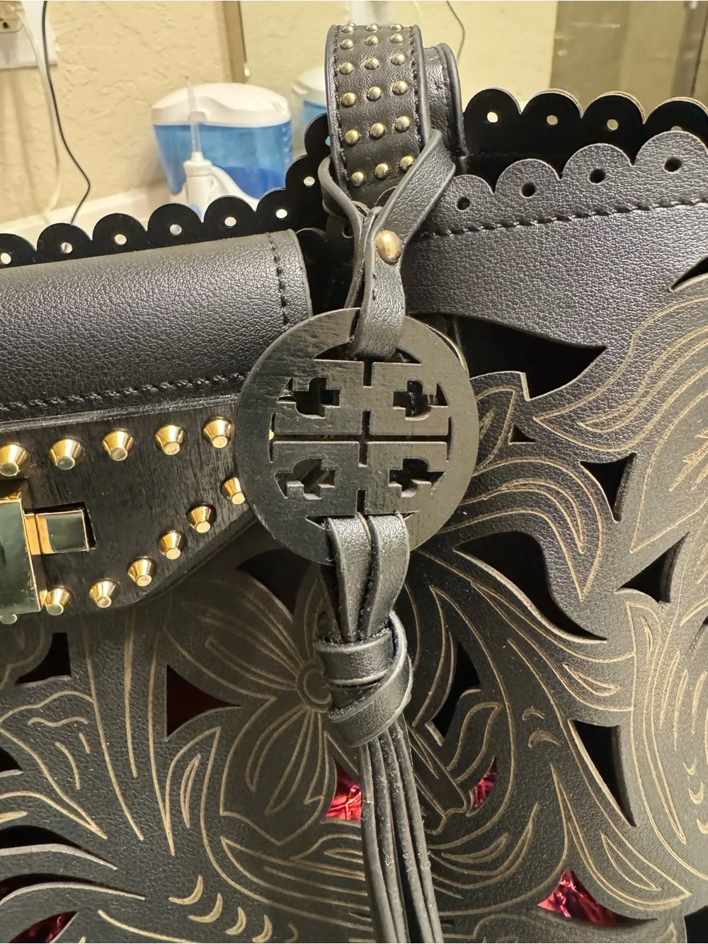 Black Cutout Leather Tote with Tassel Charm